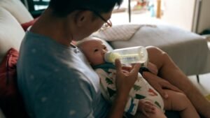 How are Singapore companies implementing new maternity leave for fathers? 0